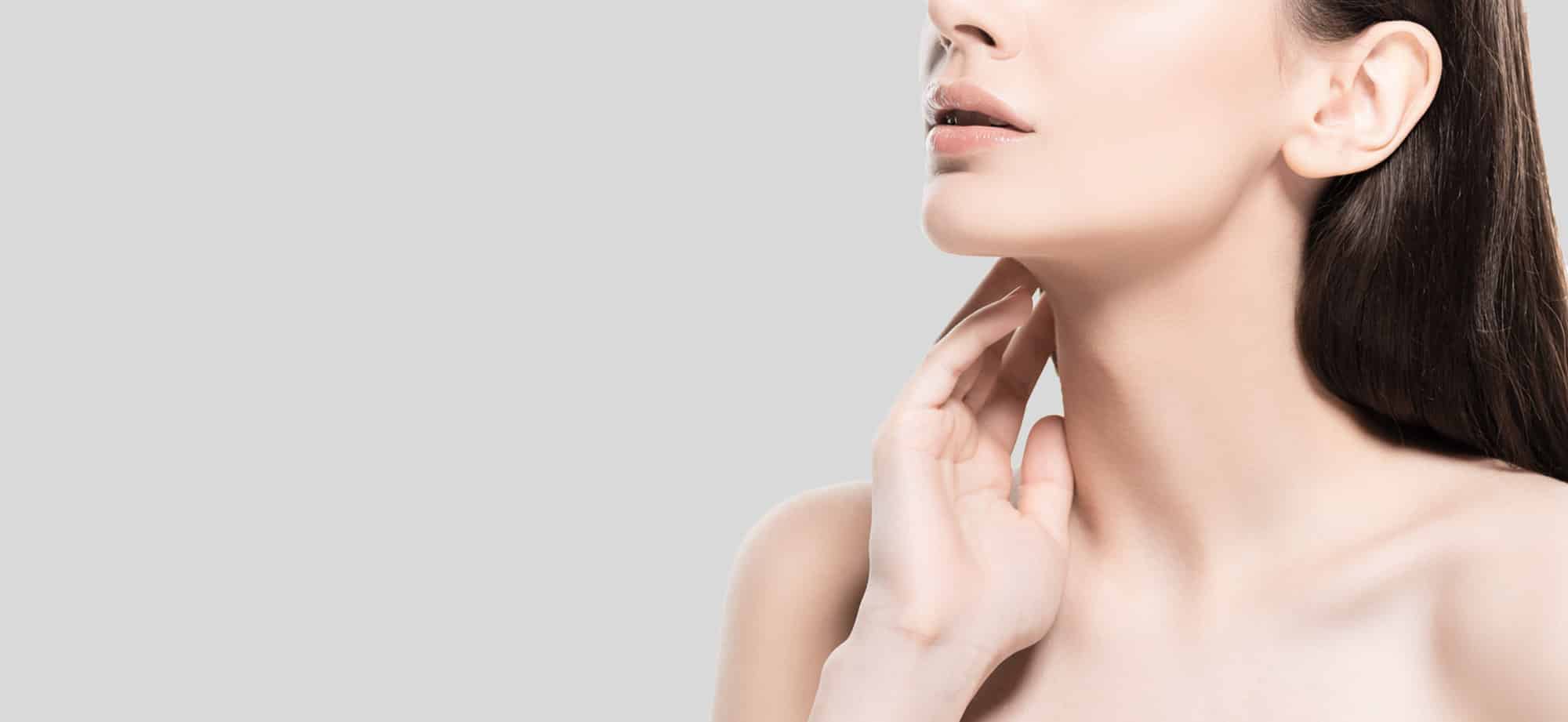 Girl with clear skin on a gray background