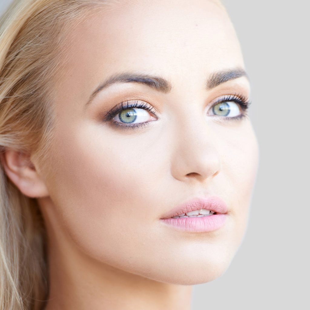 Beautiful Young Girl on A Gray Background